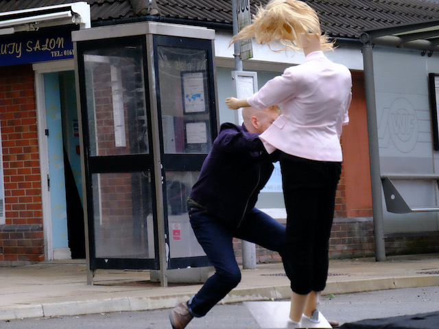 Gary saves Sarah from an oncoming car on Coronation Street