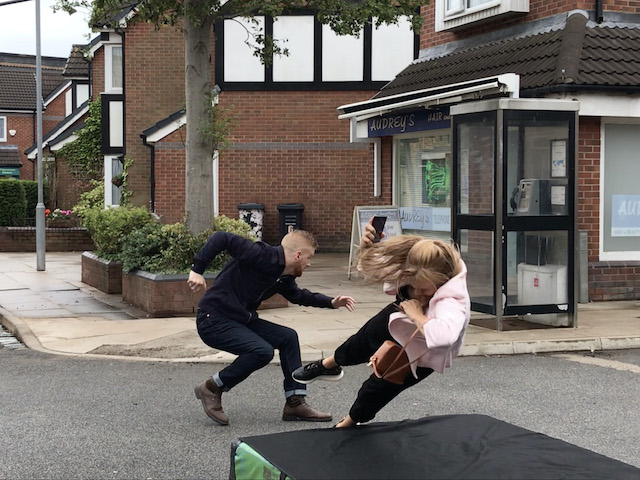 Gary saves Sarah from an oncoming car on Coronation Street