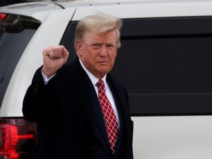 Former U.S. President and Republican presidential candidate Donald Trump gestures after arriving at Aberdeen International Airport in Aberdeen, Scotland, Britain on May 1, 2023.