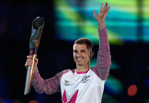 Commonwealth Games - Opening Ceremony - Alexander Stadium, Birmingham, Britain on July 28, 2022 Britainâs Max Whitlock carries the Queens Baton during the opening ceremony