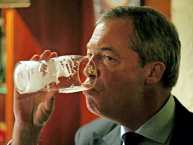 Nigel Farage drinks a pint at the Gardeners Arms in Heywood on October 7, 2014
