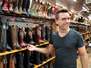 Gino D'Acampo at Allen’s boots in Austin checking out the cowboy boot