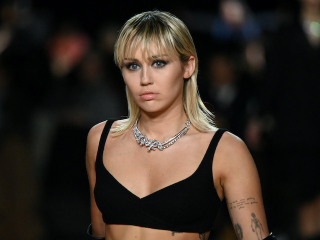Miley Cyrus presents a creation from the Marc Jacobs Fall/Winter 2020 collection during New York Fashion Week in New York, U.S. on February 12, 2020.