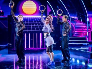 Nikita Kuzmin, Dianne Buswell and Carlos Gu on the Strictly Come Dancing results show on October 18, 2026