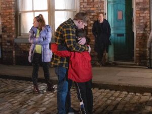 Chesney hugs Joseph as Gemma and Bernie watch on Coronation Street on February 28, 2022