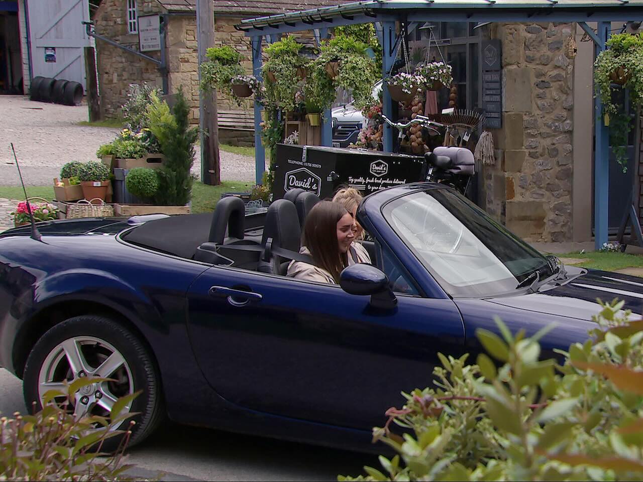 Sarah and Charity in a sports car on Emmerdale on August 19, 2024