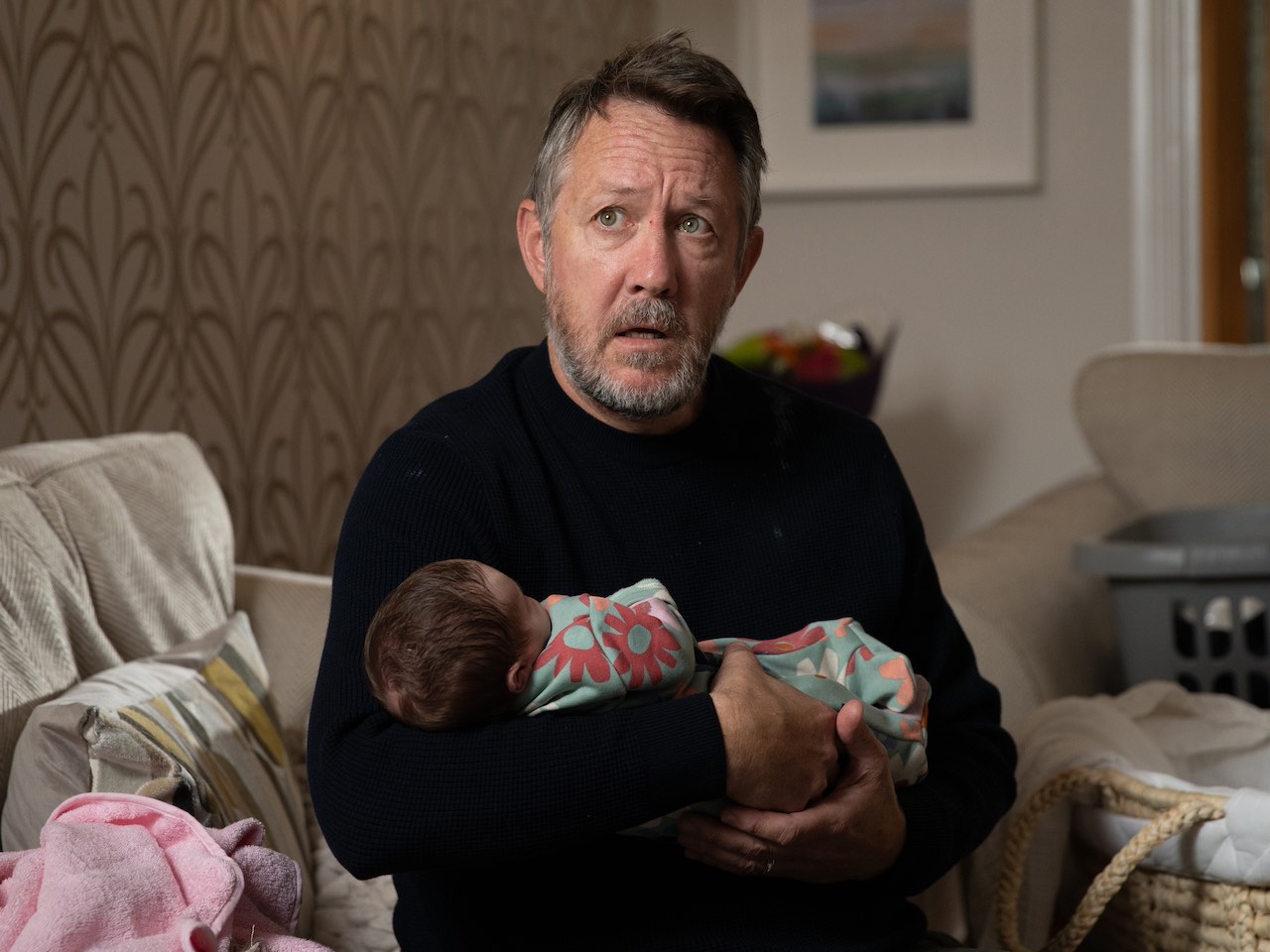 Gus holds baby Ivy on Emmerdale on December 6, 2023