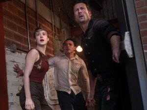 Daisy Edgar-Jones as Kate, Anthony Ramos as Javi and Glen Powell as Tyler in Twisters