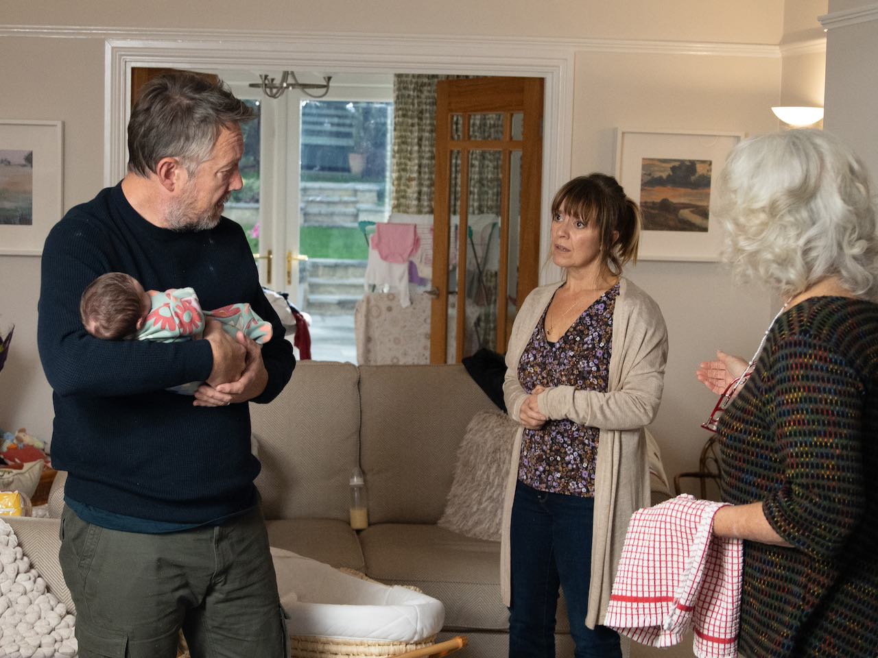Gus with baby Ivy, Rhona and Mary on Emmerdale on December 6, 2023