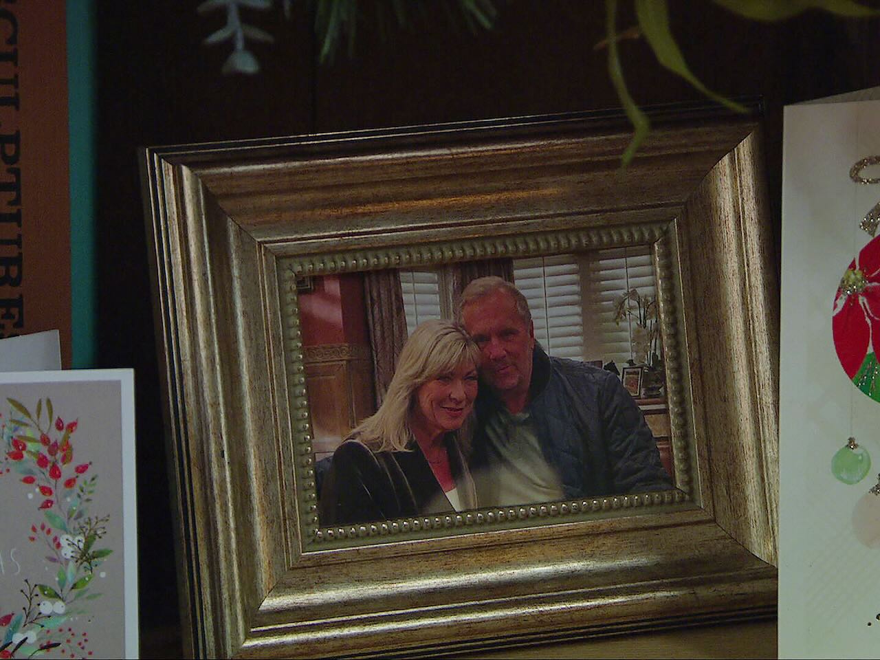 A framed photograph of Kim and Will at Home Farm on Emmerdale on December 24, 2024